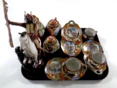 A tray containing a part Japanese eggshell coffee service together with a limited edition figure,