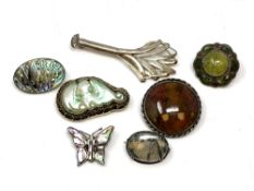 Silver brooches including Scottish, agate, jade, mother of pearl.