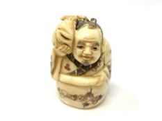 A carved Chinese bone netsuke,