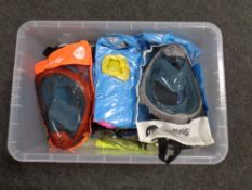 A crate of scuba diving equipment : snorkels, face masks,