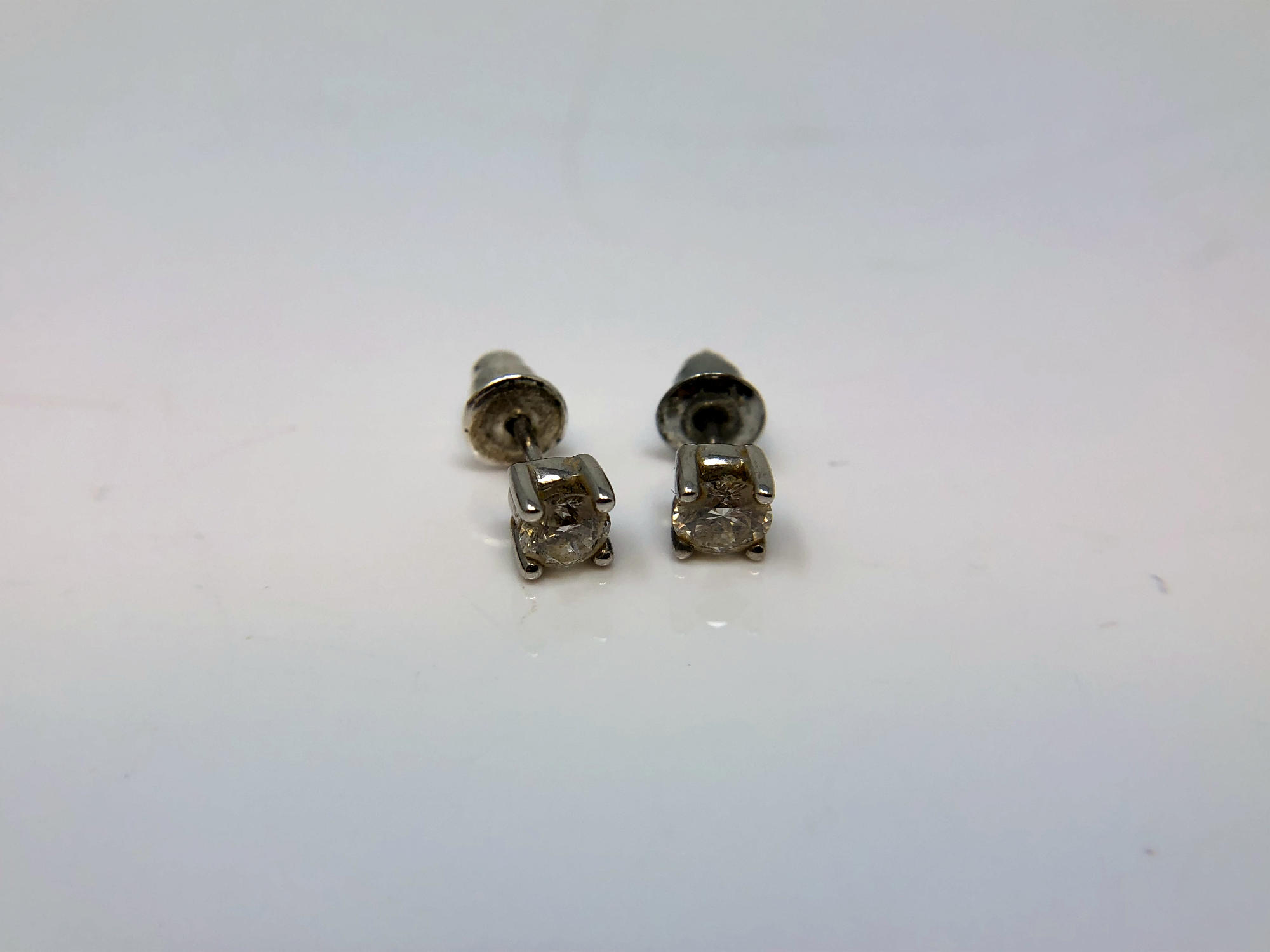 A pair of 18ct white gold diamond stud earrings, each approximately 0.2ct.