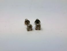 A pair of 18ct white gold diamond stud earrings, each approximately 0.2ct.