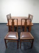 An Edwardian mahogany wind out table fitted a leaf (no handle) together with a set of six chairs