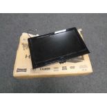 A Hitachi 26 inch LCD TV with lead and wall mounting bracket