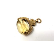 A citrine fob on ornate 9ct gold swivel mount. CONDITION REPORT: 6.9g gross.