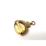 A citrine fob on ornate 9ct gold swivel mount. CONDITION REPORT: 6.9g gross.