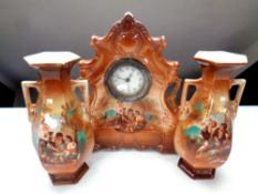 A 19th century transfer printed mantel piece clock garniture