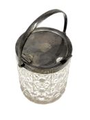 An Edwardian cut glass and silver mounted sugar pot, with swing handle opening the lid,