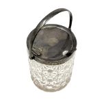 An Edwardian cut glass and silver mounted sugar pot, with swing handle opening the lid,