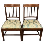 A pair of George III inlaid mahogany dining chairs, rail backed and on square tapered legs,