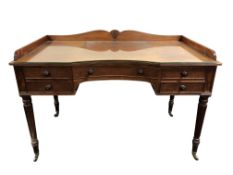 A fine Regency style mahogany dressing table, in the manner of Gillows, the inverted curved apron,