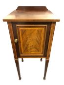 A 19th century inlaid mahogany pot cupboard, raised on tapered legs, numbered to the back 7351,