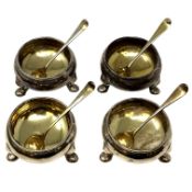 A set of four Georgian silver-gilt salts with spoons, London marks rubbed, each 8.