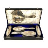 A silver five-piece dressing table set, Chester marks, boxed.