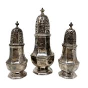 A George III trio of silver casters, Thomas Bamford, London 1801, tallest 19cm.