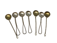 Seven silver coin inset teaspoons.