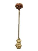 A George III gilt brass lion paw door porter.