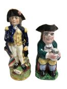 Two 19th century Staffordshire figural jugs modelled as a cider drinker and Lord Admiral Nelson,