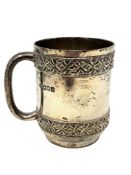 An Edwardian silver mug, Searle & Co Ltd, London 1904, height 9cm.