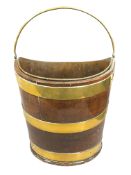 A George III mahogany navette shaped brass bound peat bucket, height 30 cm.