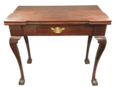 A George III mahogany card table, the inverted breakfront fitted with a drawer,