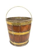 A George III mahogany navette shaped brass bound peat bucket, height 33.5 cm.