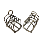 A pair of Edwardian silver five-bar toast racks, James Parks, London 1904, each 9cm long.