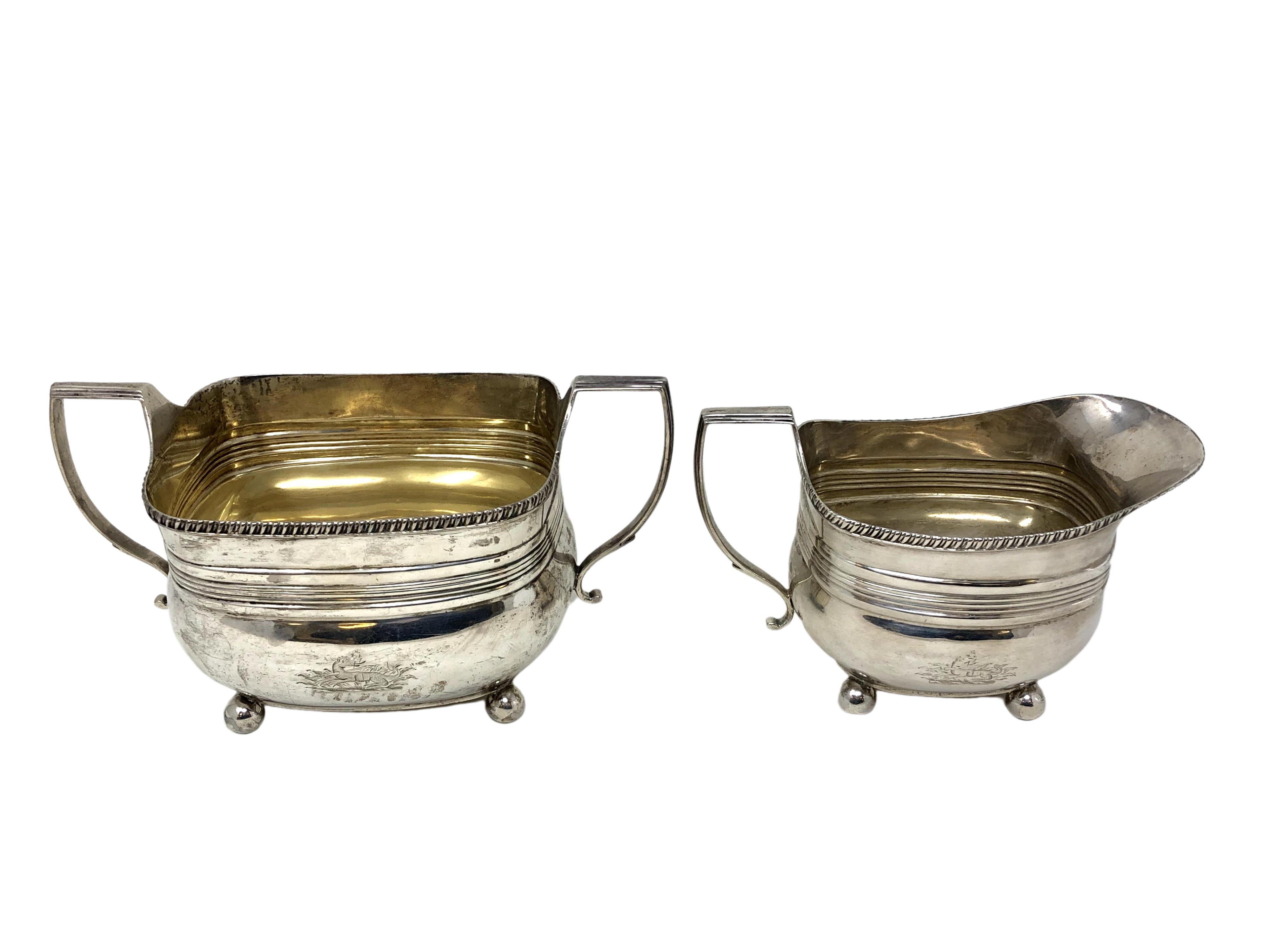 A Victorian silver sugar bowl and matching milk jug, Henry Stratford, Sheffield 1893.