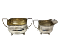 A Victorian silver sugar bowl and matching milk jug, Henry Stratford, Sheffield 1893.