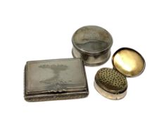 Three items of unmarked white metal, comprising a vinaigrette and two snuff boxes.