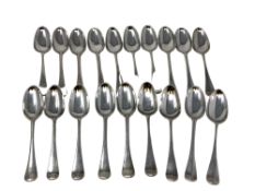 A harlequin set of nineteen Georgian silver dessert spoons, London marks differ, mostly 1738.