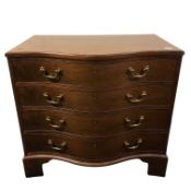 A fine George III style inlaid mahogany serpentine fronted chest of four drawers,