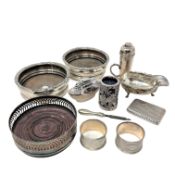 A collection of plated wares comprising a pair of wine bottle coasters, a further coaster,