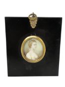 An early 19th century portrait miniature depicting a lady with blue ribbon in her hair, 4.5 cm x 3.