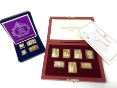 A collection of silver gilt stamps in two boxes.