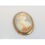 An antique rose-gold cameo brooch, 43 mm x 54 mm.