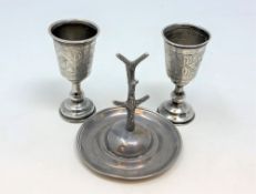 A pair of Edwardian silver goblets and an antique silver ring tree (3) CONDITION REPORT: