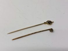 Two antique gold diamond set stick pins, about 0.