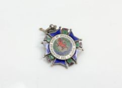 A silver and enamel medal for the Caledonian society of Johannesburg