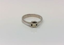 An 18ct white gold princess cut solitaire diamond ring, size M CONDITION REPORT: 2.