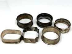 Six assorted silver napkin rings CONDITION REPORT: 55.