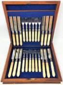 A boxed set of 24 silver fish knives and forks with ivory handles,