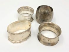 Four silver napkin rings including a Lindisfarne pattern example by Reid & Sons (4)