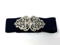 A Victorian silver buckle on elasticated belt,