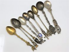Nine highly ornate silver gilt and enamel spoons, including Napoleon.