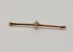 A 15ct gold brooch set with 0.25ct diamond, 3.5g.