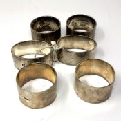 Three pairs of heavy gauge silver serviette rings, 314g.