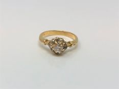 An 18ct gold diamond cluster ring, centre stone approx. 0.