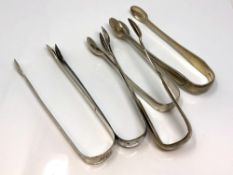 Five pairs of Georgian/Victorian silver sugar tongs (5) CONDITION REPORT: 219.