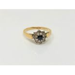 An 18ct gold sapphire and diamond cluster ring, size M CONDITION REPORT: 3.